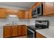 Well-maintained kitchen featuring stainless steel appliances, wood cabinets and countertops at 105 Coral Ridge Cir, Franklinton, NC 27525