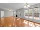 Bright living room featuring hardwood floors, a fireplace, and multiple windows allowing natural light at 105 Coral Ridge Cir, Franklinton, NC 27525