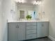 Well-lit bathroom with a dual sink vanity, neutral cabinets, and modern hardware at 108 Clements Dr, Morrisville, NC 27560
