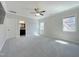 Spacious bedroom boasts neutral walls, carpet, ceiling fan, and access to a bright ensuite bathroom at 108 Clements Dr, Morrisville, NC 27560
