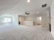Large carpeted bonus room with a ceiling fan, recessed lighting, and bathroom access at 108 Clements Dr, Morrisville, NC 27560