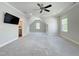 Bonus room with carpet flooring, ceiling fan and adjacent bathroom space at 108 Clements Dr, Morrisville, NC 27560