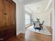 Formal dining room showcasing decorative wainscoting, tray ceiling and modern chandelier at 108 Clements Dr, Morrisville, NC 27560