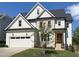 Charming two-story home featuring a two-car garage and a blend of siding and brick accents at 108 Clements Dr, Morrisville, NC 27560