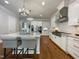 Bright kitchen with large island, pendant lights, and modern stainless steel appliances at 108 Clements Dr, Morrisville, NC 27560