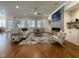 Bright living room features a fireplace, hardwood floors, and abundant natural light at 108 Clements Dr, Morrisville, NC 27560