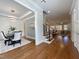 Open-concept living space adjoining dining area with hardwood floors and staircase at 108 Clements Dr, Morrisville, NC 27560