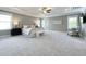 Spacious main bedroom with tray ceiling, carpeted floors, and ample natural light at 108 Clements Dr, Morrisville, NC 27560