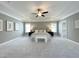 Large main bedroom with carpeting, decorative ceiling and several windows for natural light at 108 Clements Dr, Morrisville, NC 27560