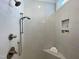 Spacious tiled shower featuring dual shower heads, bench seating, and built-in shelving at 108 Clements Dr, Morrisville, NC 27560