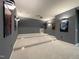 Theater room featuring tiered seating, wall sconces and projector at 108 Clements Dr, Morrisville, NC 27560