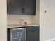 Cozy wet bar with stylish cabinetry, beverage cooler, and counter space, perfect for entertaining at 108 Clements Dr, Morrisville, NC 27560
