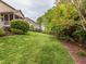 Spacious backyard and patio area with lush greenery and potential for outdoor enjoyment at 111 Gathering Place Pl, Durham, NC 27713