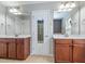 Bright bathroom featuring double sink vanity and access to the tiled walk-in shower and soaking tub at 111 Gathering Place Pl, Durham, NC 27713