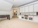 Spacious bonus room with built-in shelving and cabinets for ample storage and organization at 111 Gathering Place Pl, Durham, NC 27713