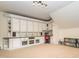 Bonus room with built-in shelving and adjacent desk area with a view of backyard at 111 Gathering Place Pl, Durham, NC 27713