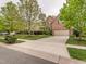 Suburban two-story home with a long driveway and beautiful mature trees in a well-maintained neighborhood at 111 Gathering Place Pl, Durham, NC 27713