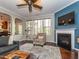 Inviting living space with hardwood floors, a fireplace, and open layout, perfect for entertaining guests at 111 Gathering Place Pl, Durham, NC 27713
