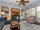 Comfortable living room featuring hardwood floors, stylish decor, and open access to the kitchen and dining area at 111 Gathering Place Pl, Durham, NC 27713