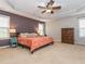 Spacious main bedroom with tray ceiling, ceiling fan, and large windows provides comfortable natural light at 111 Gathering Place Pl, Durham, NC 27713