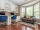Home office features built-in shelves, a desk, and a comfortable seating area at 111 Gathering Place Pl, Durham, NC 27713