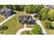 An aerial view of the property displaying the layout, landscaping, and surrounding neighborhood on a sunny day at 121 Westchase Run, Sanford, NC 27330
