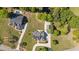 Aerial view of a home with a large backyard, pool, surrounded by beautiful mature trees at 121 Westchase Run, Sanford, NC 27330