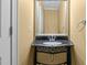 Bathroom featuring dark marble sink and unique metal design at 121 Westchase Run, Sanford, NC 27330