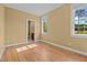 Bedroom with hardwood floors and a window with natural light at 121 Westchase Run, Sanford, NC 27330