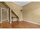 Bedroom featuring hardwood floors, built-in desk space, and natural light at 121 Westchase Run, Sanford, NC 27330