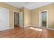 Bedroom featuring hardwood floors, two doorways and a window at 121 Westchase Run, Sanford, NC 27330