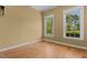 Cozy room featuring hardwood floors and a beautiful view from the two windows at 121 Westchase Run, Sanford, NC 27330