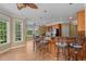Kitchen bar with granite countertops, wooden cabinets, and high stools, perfect for entertaining at 121 Westchase Run, Sanford, NC 27330