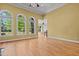 Inviting living room with hardwood floors, a ceiling fan, and windows providing views of the outdoor space at 121 Westchase Run, Sanford, NC 27330
