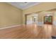 Open living space featuring hardwood floors, large windows, and elegant trim detailing throughout at 121 Westchase Run, Sanford, NC 27330