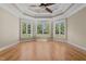 Spacious main bedroom features tray ceilings and three large windows with a backyard view at 121 Westchase Run, Sanford, NC 27330