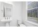 Cozy bathroom with modern fixtures and plenty of natural light at 1215 Corkery Ridge Ct, Cary, NC 27519