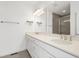 Bathroom with double vanity, quartz countertops and large mirror, plus tiled floor and tiled shower at 1215 Corkery Ridge Ct, Cary, NC 27519
