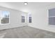 Spacious bedroom with neutral carpet, plenty of natural light and multiple windows at 1215 Corkery Ridge Ct, Cary, NC 27519
