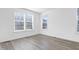 Comfortable bedroom with wood flooring, natural light, and white walls at 1215 Corkery Ridge Ct, Cary, NC 27519