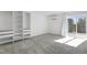 Bedroom featuring carpeted flooring, closet system, and large sliding glass doors to a deck at 1215 Corkery Ridge Ct, Cary, NC 27519