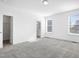 Well-lit bedroom includes walk-in closet and an ensuite bath that can be seen through the doorway at 1215 Corkery Ridge Ct, Cary, NC 27519