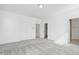 Bedroom featuring neutral carpet and a full closet, adjacent to the ensuite bath at 1215 Corkery Ridge Ct, Cary, NC 27519