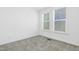 Well-lit bedroom featuring neutral carpet and 2 windows providing lots of natural light at 1215 Corkery Ridge Ct, Cary, NC 27519