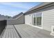 Large deck featuring grey decking and black railings, plus glass sliding door access at 1215 Corkery Ridge Ct, Cary, NC 27519
