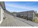Large deck featuring grey decking and black railings, offering views of the townhome community at 1215 Corkery Ridge Ct, Cary, NC 27519