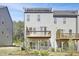 Back exterior showing deck, rooftop deck, patio, and well-maintained landscaping at 1215 Corkery Ridge Ct, Cary, NC 27519