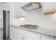 Modern kitchen features stainless steel appliances, granite countertops, and white backsplash at 1215 Corkery Ridge Ct, Cary, NC 27519