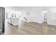 Bright living area with wood floors and access to kitchen at 1215 Corkery Ridge Ct, Cary, NC 27519
