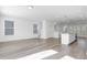 Bright, open-concept living space featuring modern finishes, hardwood floors, and lots of natural light at 1215 Corkery Ridge Ct, Cary, NC 27519